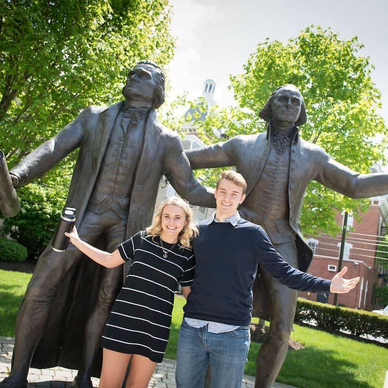 Students pose for pictures with the statues of George Washington and Thomas Jefferson during the Creosote Affects photo shoot May 1, 2019 at Washington &amp; Jefferson College.